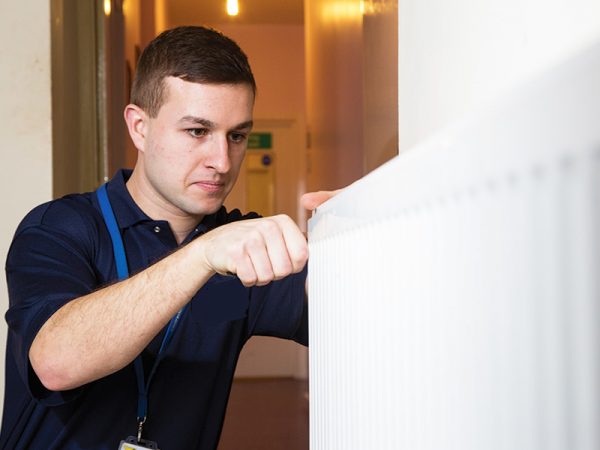 Gas fitter maintaining a property